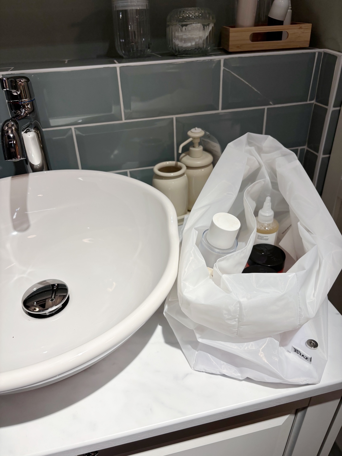 ZVESE bag open on marble sink