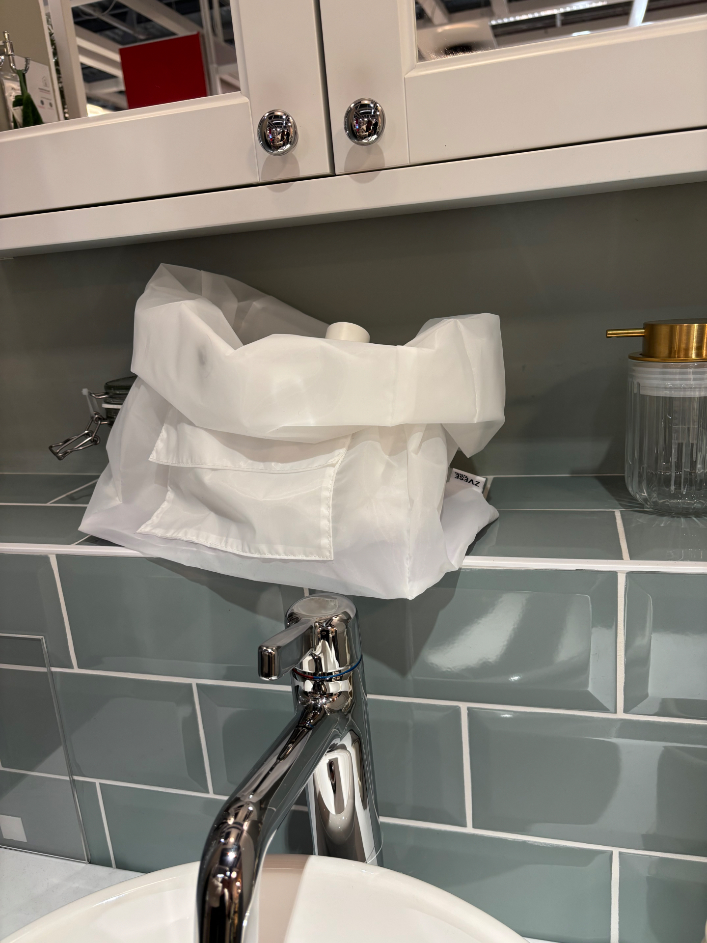 ZVESE bag folded open beside faucet